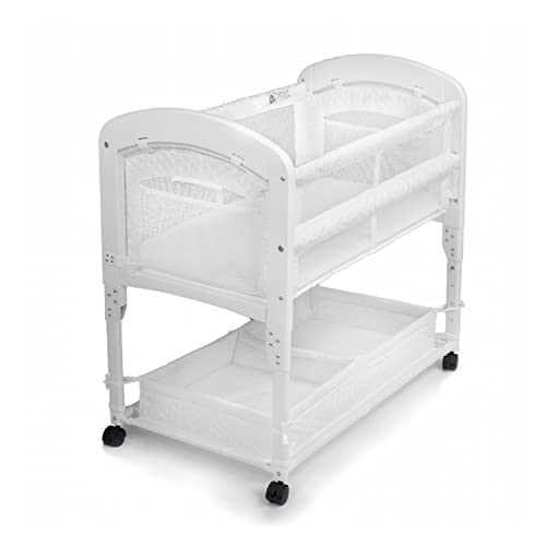 Arm’s Reach Cambria Co-Sleeper Bedside Bassinet Featuring Height-Adjustable Legs, Curved Wooden Ends, Breathable Mesh Sides with Pockets, and Large Lower Storage Basket, White