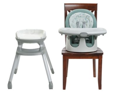 Picture of the Graco floor2table high chair separated into its two compentents, the feet or base which can be separated from the seat