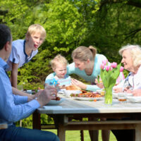 Baby at Dinner Table with Family