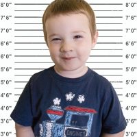 Arrests by First Name - Toddler posing for mug shot