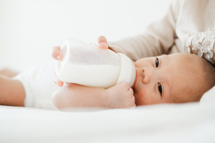 Baby Drinking from Glass Bottle