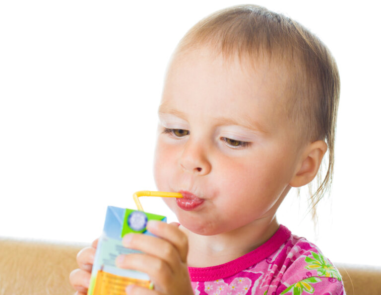 Baby Drinking Juice from a Straw