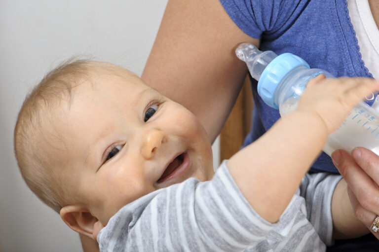 Happy Baby Drinking Similac from Bottle