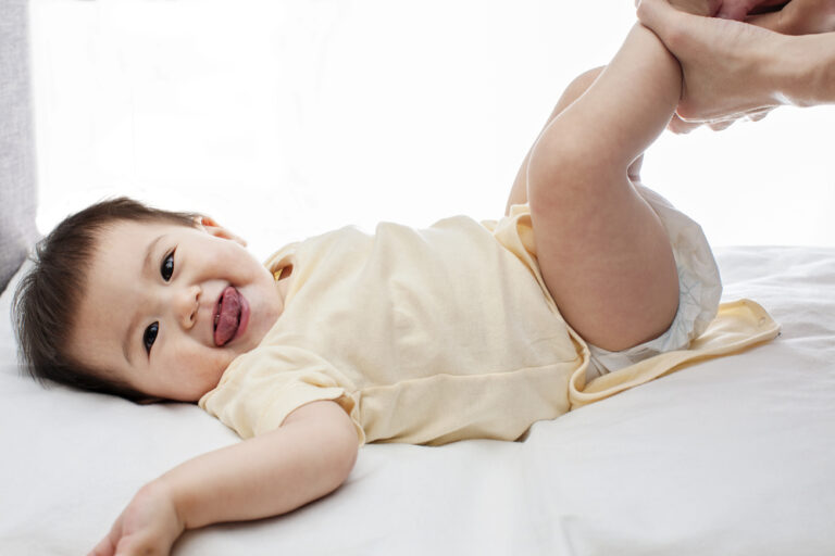 Pretty Baby Girl Getting Her Diaper Changed