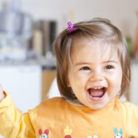 Baby Girl with Hair Pulled Back with Barrette