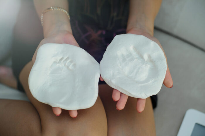 Molds of baby hand and foot prints