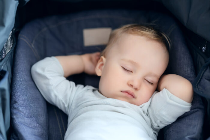 Baby relaxed and sleeping in stroller