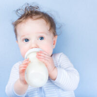 baby drinking from a bottle