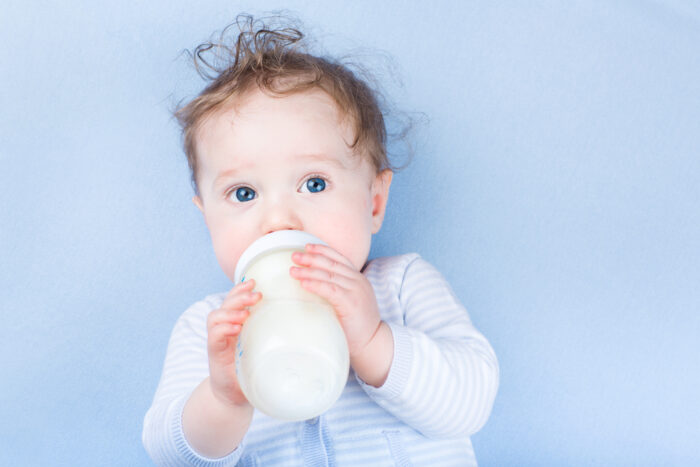 baby drinking from a bottle