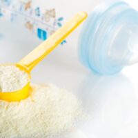baby formula with measure and a bottle