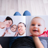 Woman Looking At Photo Album