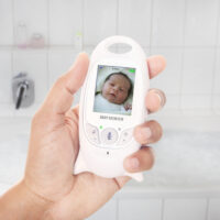 handheld baby monitor with picture of baby