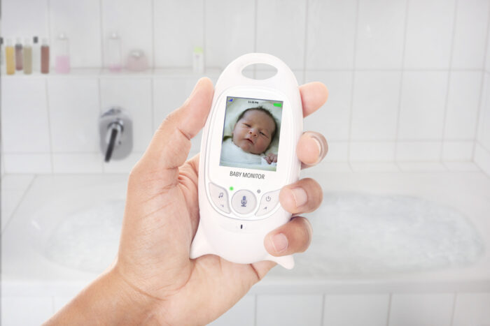 handheld baby monitor with picture of baby