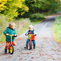 toddlers riding bicycles