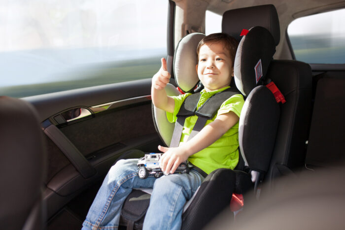 child sitting in a car seat in a vehicle