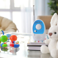 Baby monitor and different accessories on table in room