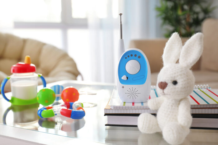 Baby monitor and different accessories on table in room