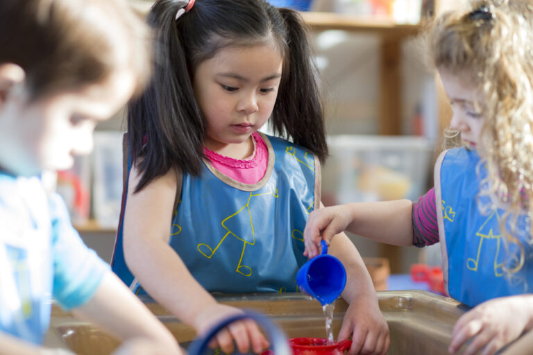 children playing with water table