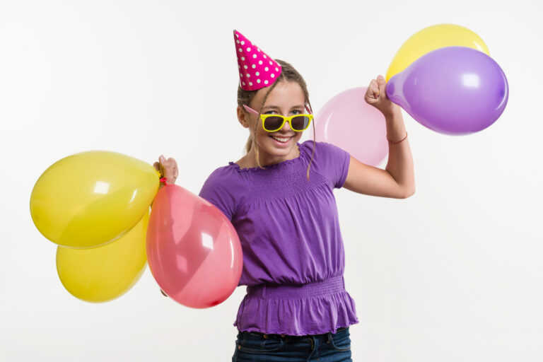 13 year old birthday girl with balloons