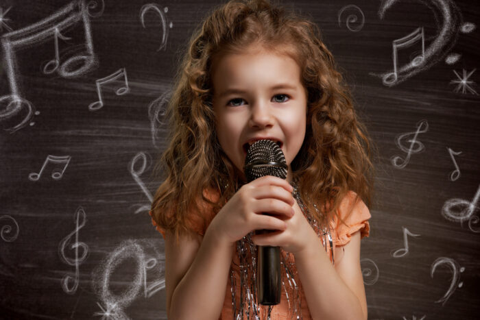 Little Girl Singing in Microphone