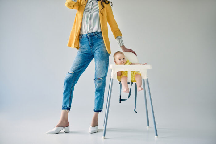 Cropped Mom with Baby in Stokke High Chair