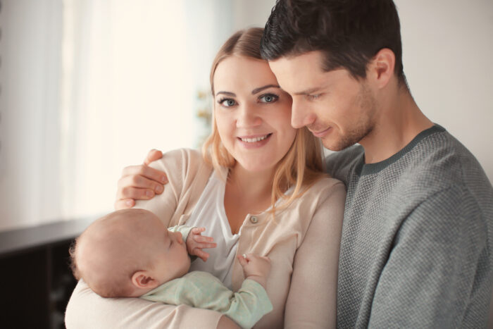 Mom and Dad with newborn baby