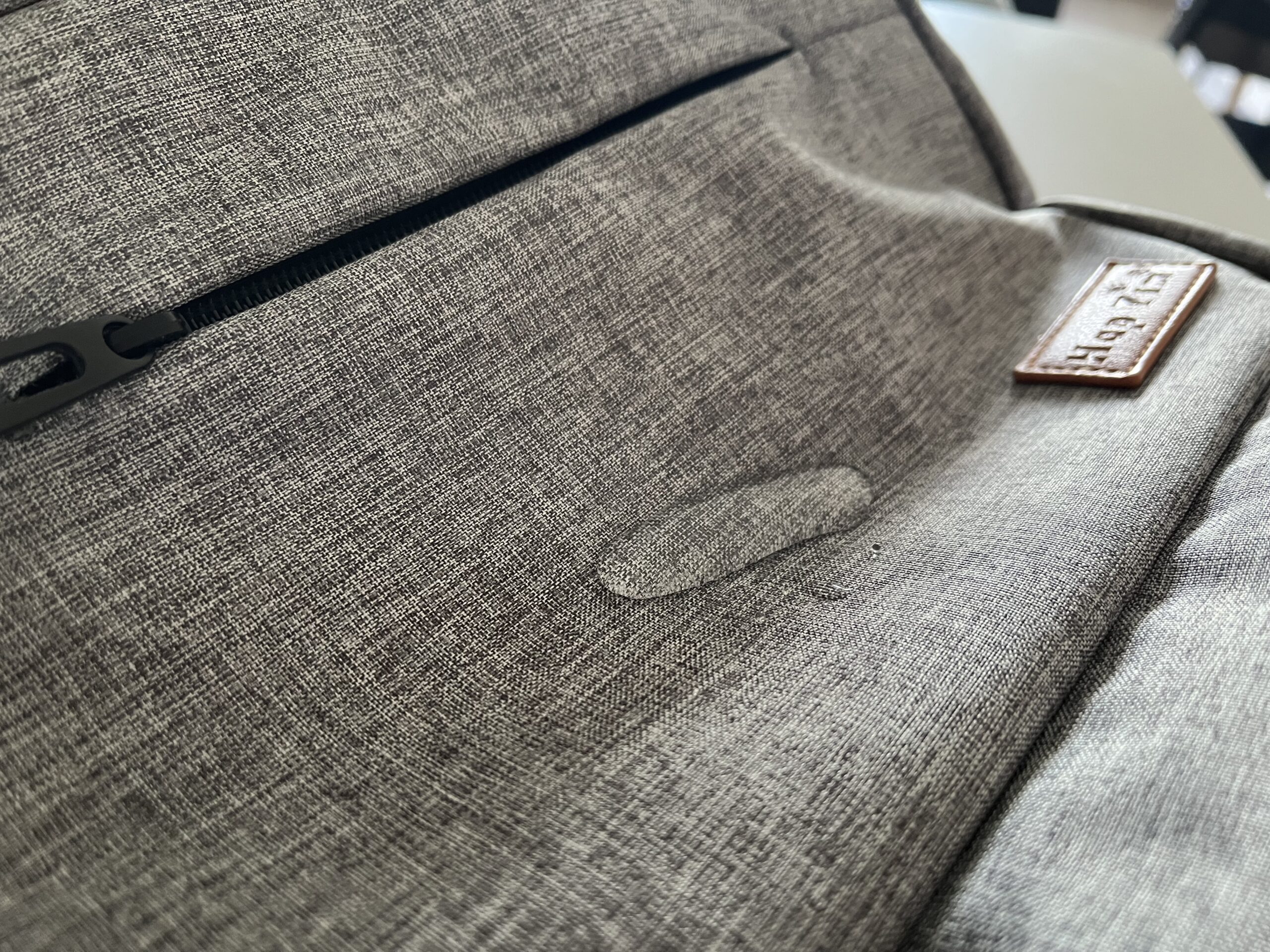 Liquid slicks off the water-resistant fabric of the HapTim Diaper Backpack.