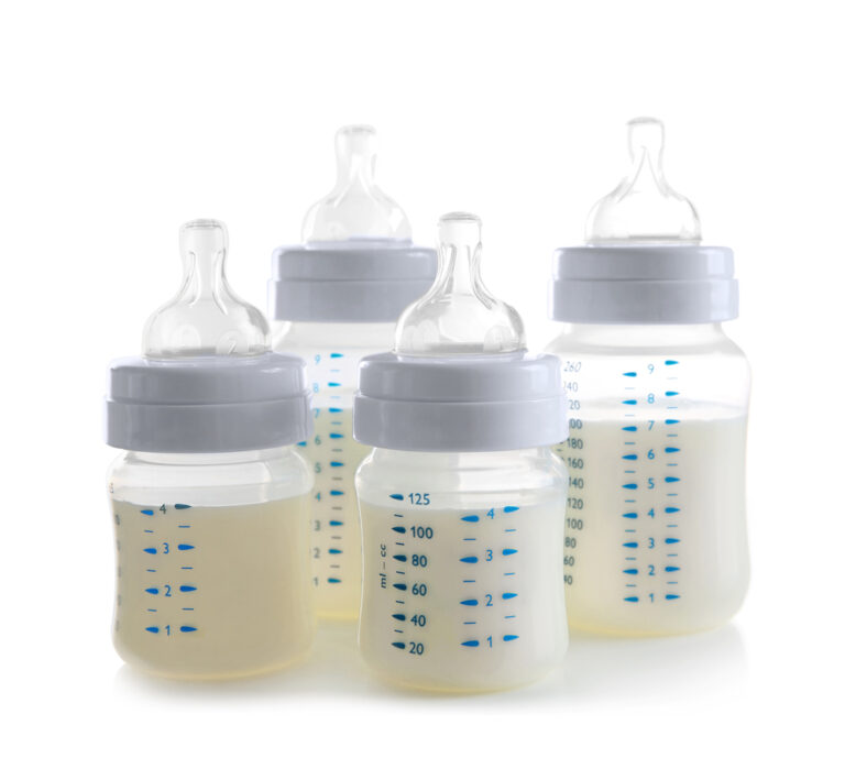 four different baby bottles isolated on a white background