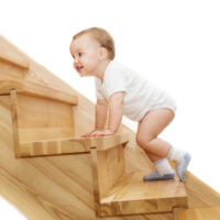toddler crawling up stairs
