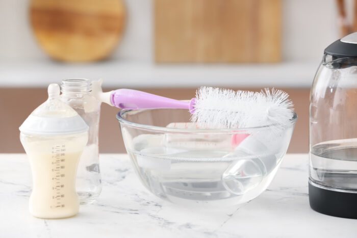 bowl of hot water for cleaning baby bottles