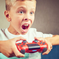 young boy playing video games