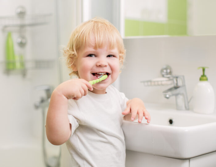 toddler brushing their teeth