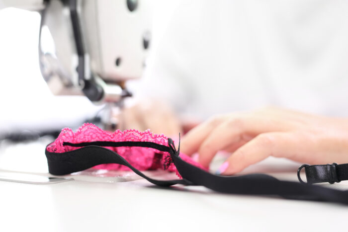 woman sewing together a headband