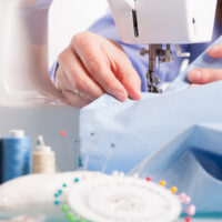 woman sewing fabric