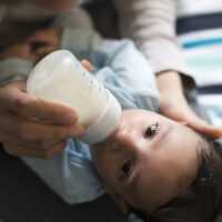 baby drinking a bottle