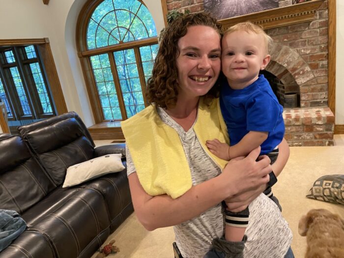 mom and baby with burp boss burp cloth over shoulders