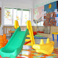 Indoor slide and other play items in a classroom