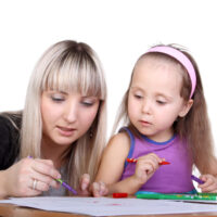 Mom Helping Her Daughter Write Her Name