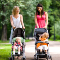 Two mom's pushing Britax stroller