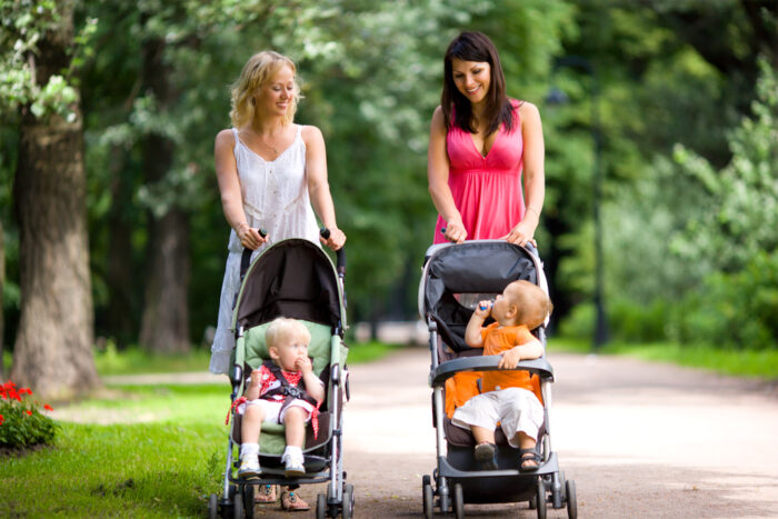 Two mom's pushing Britax stroller