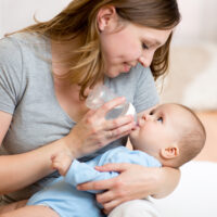 Mommy Feeding Baby a Bottle
