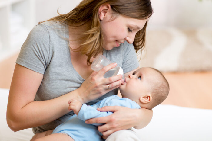 Mommy Feeding Baby a Bottle