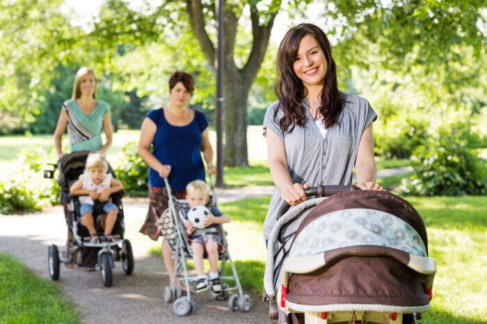 3 moms pushing strollers