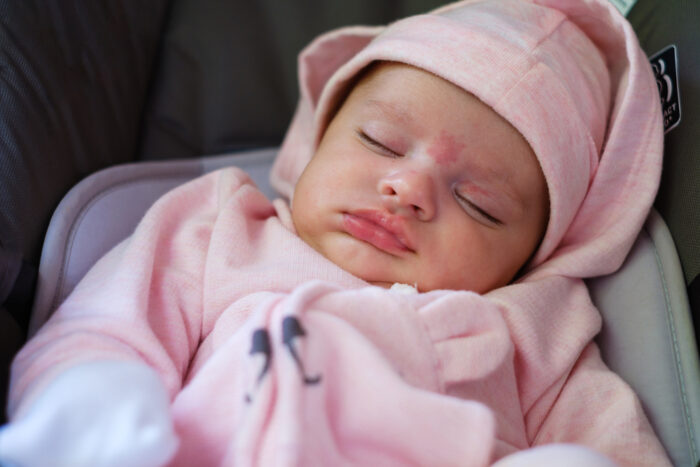 baby girl sleeping in car seat