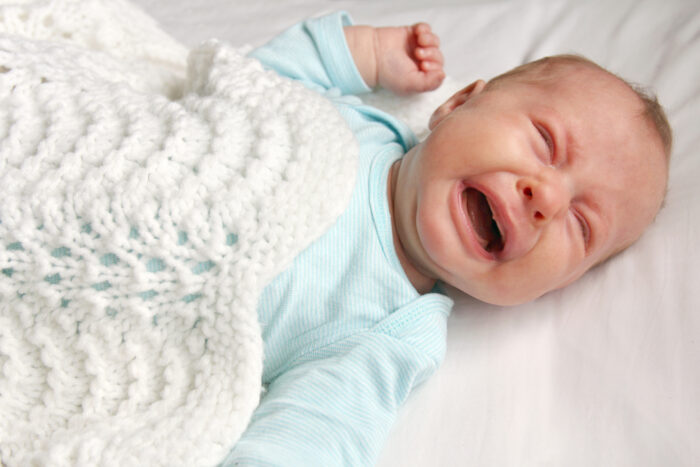 Little Newborn Crying in Crib