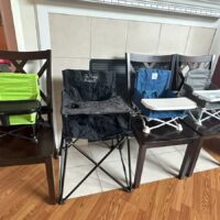a row of portable high chairs