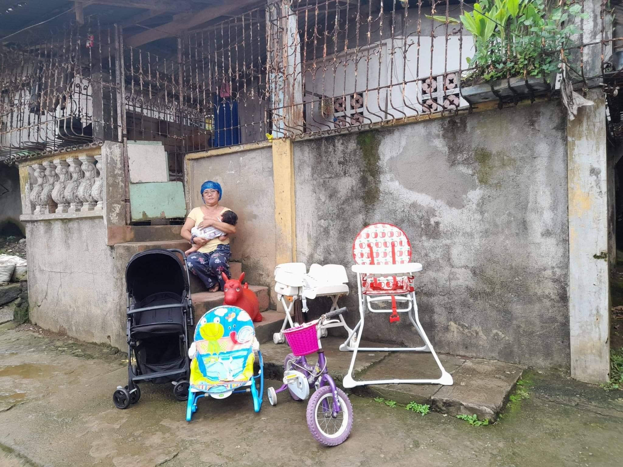Rosa with baby and baby gear in the philippines