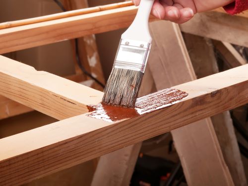 staining baby gate wood frame with brush