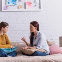 mother talking to her teenage daughter