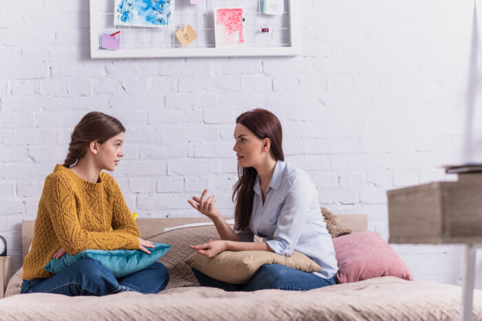 mother talking to her teenage daughter